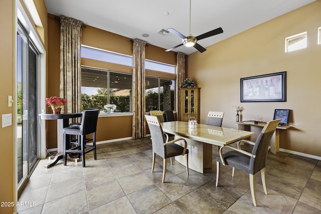 dining space featuring ceiling fan, baseboards, and visible vents