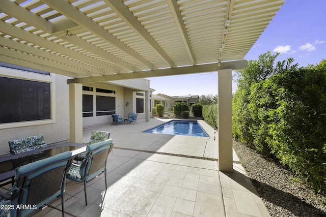 pool featuring a patio area, outdoor dining area, and a pergola
