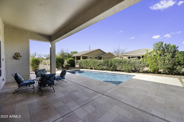 view of pool featuring a fenced in pool and a patio