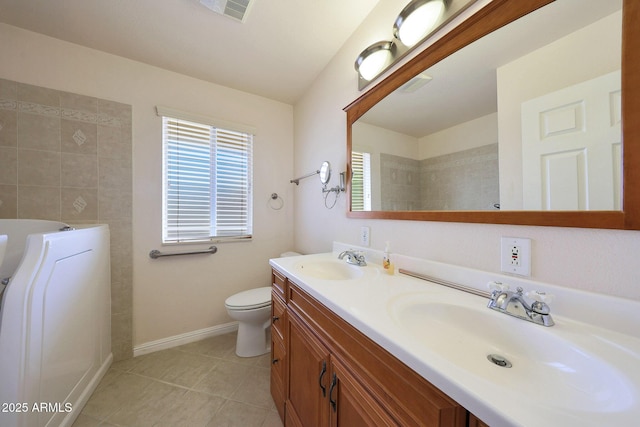 bathroom with double vanity, a sink, visible vents, and tile patterned floors