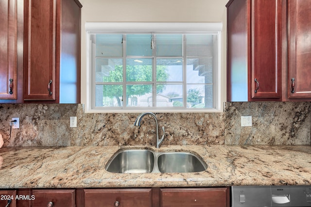 kitchen with backsplash, plenty of natural light, and sink