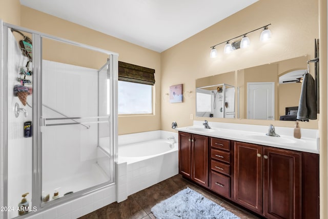 bathroom with double sink vanity, independent shower and bath, and tile floors