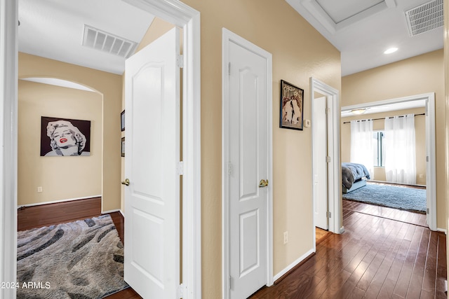 hallway with dark hardwood / wood-style floors