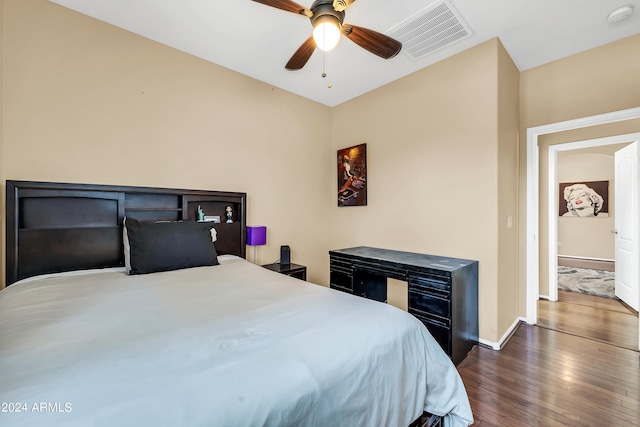 bedroom featuring ceiling fan and dark hardwood / wood-style floors