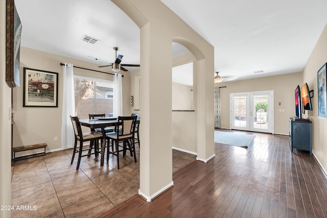 dining area featuring tile flooring and ceiling fan