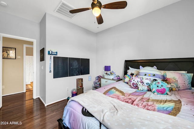 bedroom with ceiling fan and dark wood-type flooring