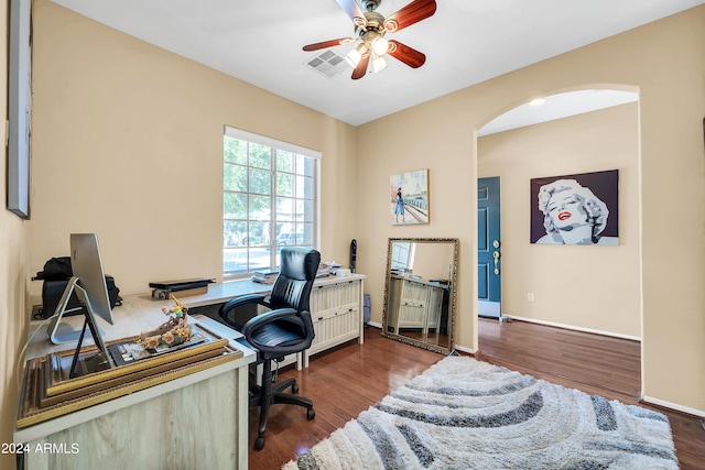 office with dark hardwood / wood-style floors and ceiling fan