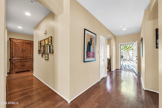 hallway with dark hardwood / wood-style flooring