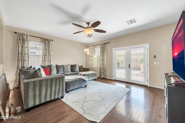 living room with ceiling fan, french doors, and dark wood-type flooring