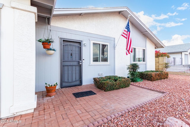 doorway to property with a patio