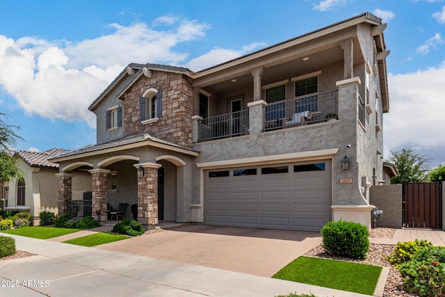 2605 S Quaintance St, Gilbert, AZ 85295 - view of front of property featuring stucco siding, covered porch, a gate, decorative driveway, and an attached garage