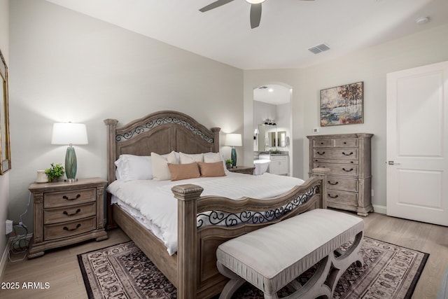 2605 S Quaintance St, Gilbert, AZ 85295 - bedroom with light wood finished floors, baseboards, and ensuite bathroom