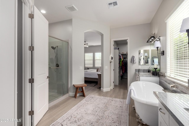 2605 S Quaintance St, Gilbert, AZ 85295 - full bath featuring a stall shower, vanity, a ceiling fan, and wood finished floors