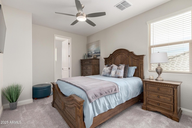 2605 S Quaintance St, Gilbert, AZ 85295 - carpeted bedroom with multiple windows, baseboards, a ceiling fan, and connected bathroom