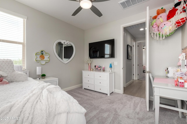 2605 S Quaintance St, Gilbert, AZ 85295 - bedroom with light colored carpet, multiple windows, baseboards, and ceiling fan