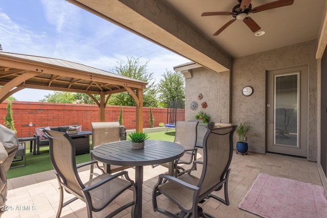 2605 S Quaintance St, Gilbert, AZ 85295 - view of patio / terrace featuring a gazebo, outdoor dining space, a ceiling fan, and an outdoor living space