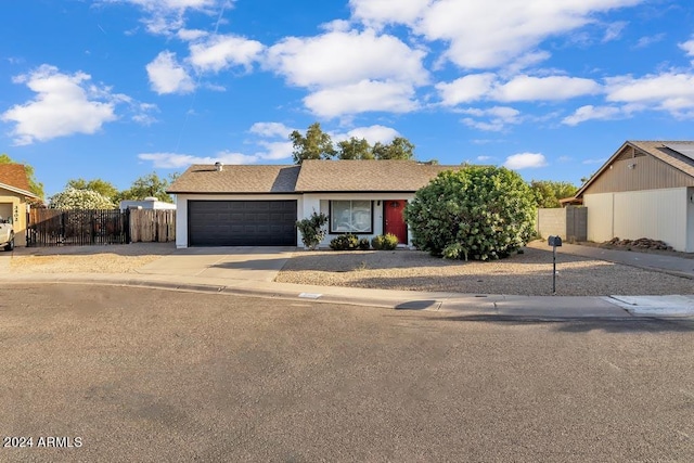 single story home featuring a garage