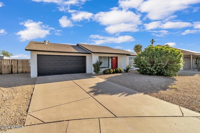 ranch-style home featuring a garage