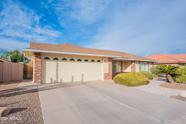 ranch-style house featuring a garage