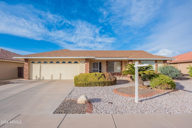 ranch-style house featuring a garage