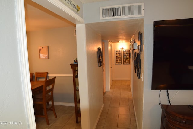 hallway with light tile patterned flooring