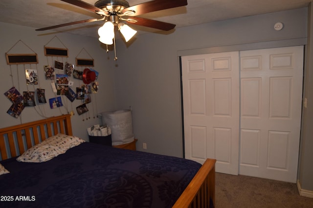 carpeted bedroom featuring a closet and ceiling fan