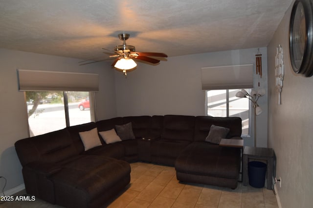 living room with light hardwood / wood-style floors and ceiling fan