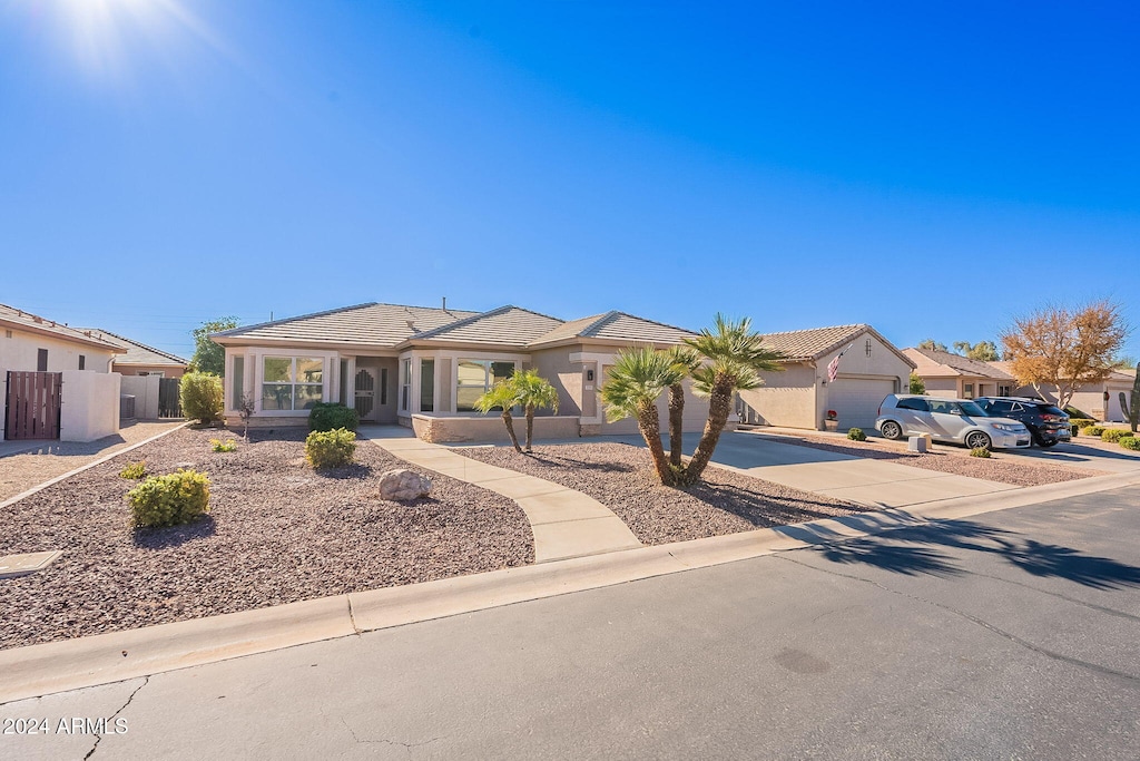 single story home featuring a garage