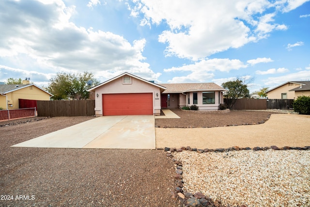 single story home with a garage