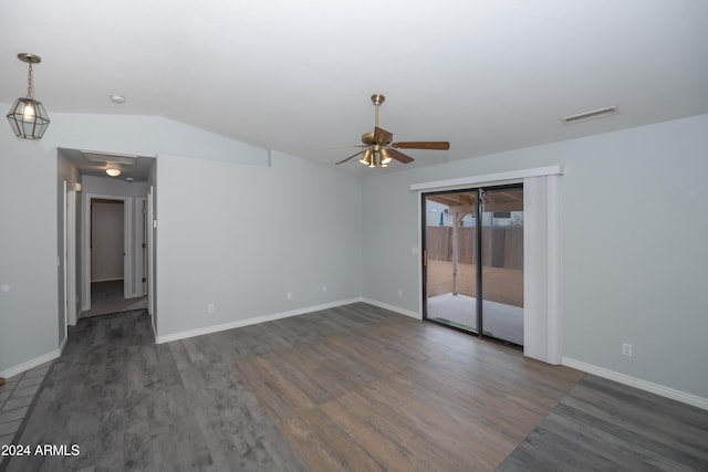 spare room featuring ceiling fan, dark hardwood / wood-style flooring, and lofted ceiling