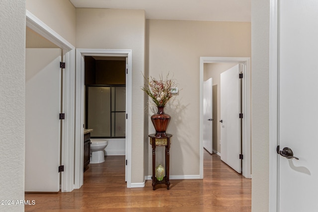 corridor with light wood-type flooring