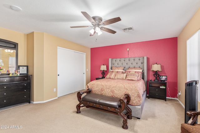 bedroom with light colored carpet and ceiling fan