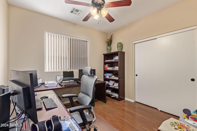 office featuring hardwood / wood-style floors and ceiling fan