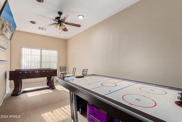 playroom with carpet and ceiling fan