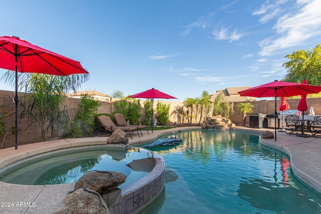 view of swimming pool with a patio area