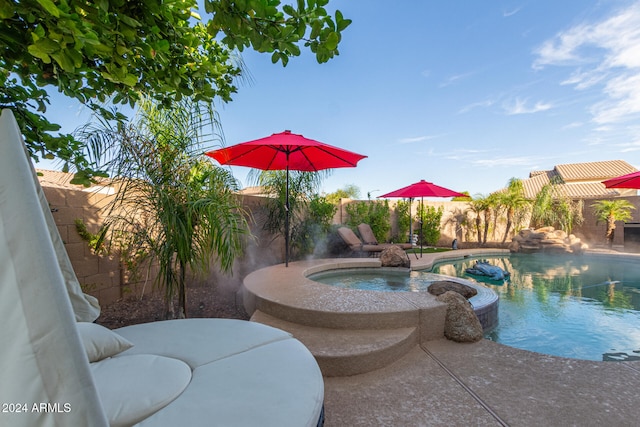 view of swimming pool with an in ground hot tub