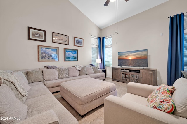 living room featuring ceiling fan, light tile patterned floors, and high vaulted ceiling