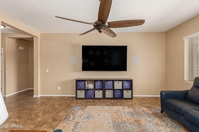 291 E Canyon Rock Rd, San Tan Valley, AZ 85143 - living room featuring a ceiling fan and baseboards