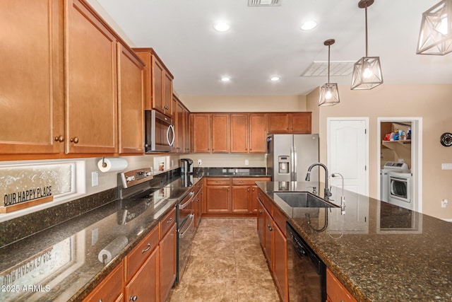 291 E Canyon Rock Rd, San Tan Valley, AZ 85143 - kitchen featuring a sink, brown cabinets, stainless steel appliances, decorative light fixtures, and washer / clothes dryer