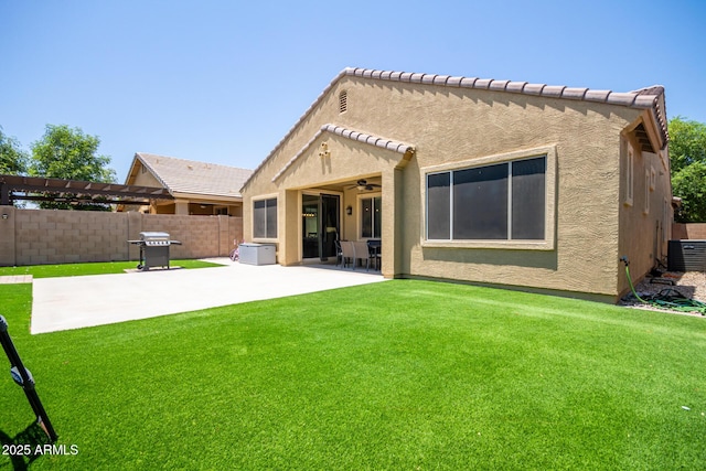 291 E Canyon Rock Rd, San Tan Valley, AZ 85143 - rear view of property featuring a ceiling fan, fence, a yard, cooling unit, and a patio
