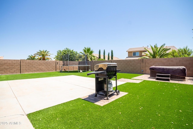 291 E Canyon Rock Rd, San Tan Valley, AZ 85143 - view of yard with a patio, a fenced backyard, a hot tub, and a trampoline