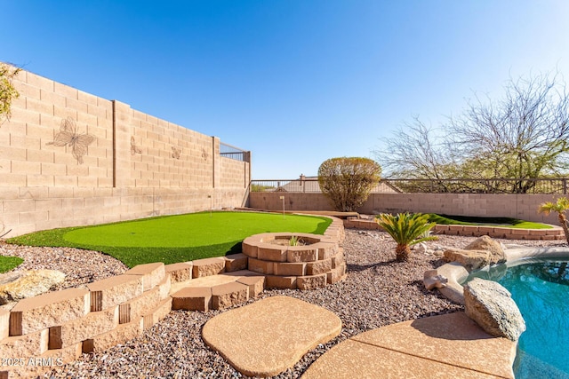 view of yard with a fenced backyard