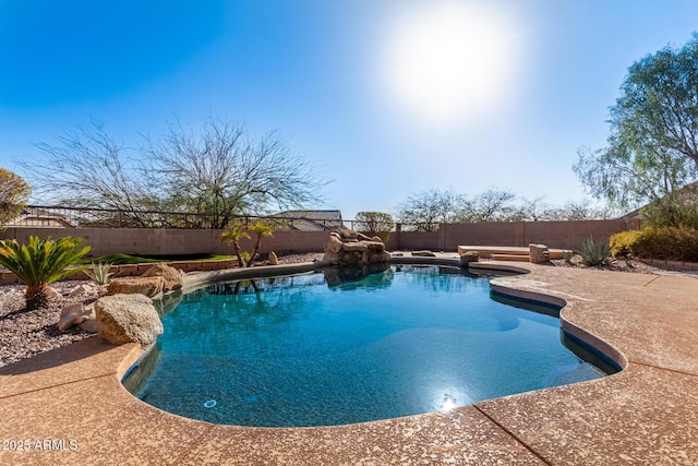 view of pool featuring a patio area, a fenced in pool, and a fenced backyard