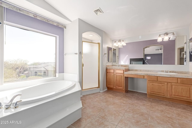 bathroom featuring a bath, visible vents, a shower stall, and a sink