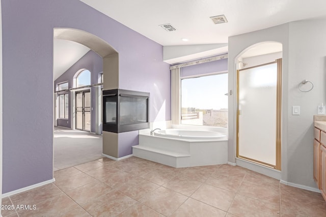 bathroom featuring visible vents, a healthy amount of sunlight, and a stall shower