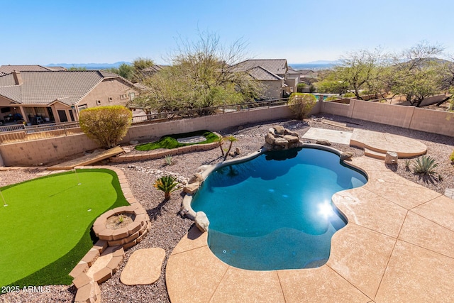 view of pool featuring a patio, a fenced backyard, and a fenced in pool