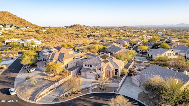 drone / aerial view featuring a mountain view and a residential view