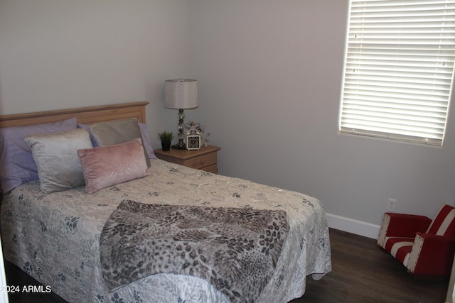 bedroom featuring dark hardwood / wood-style floors