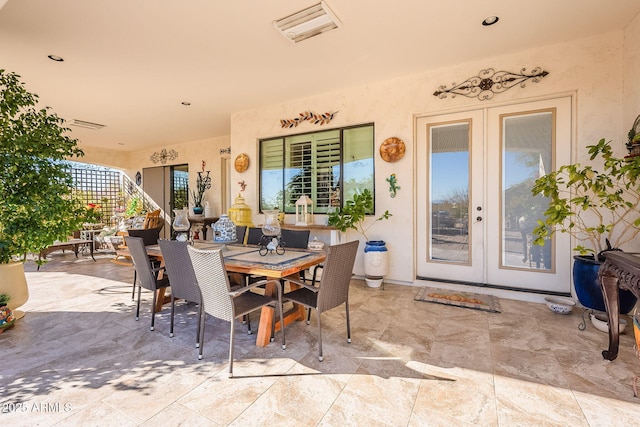 view of patio featuring french doors