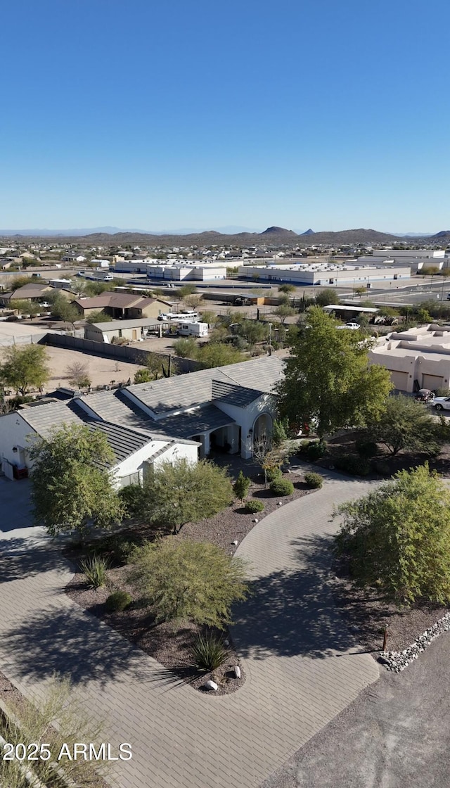 birds eye view of property featuring a mountain view